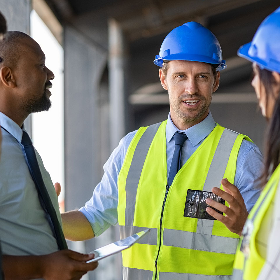 Construction workers planning maintenance