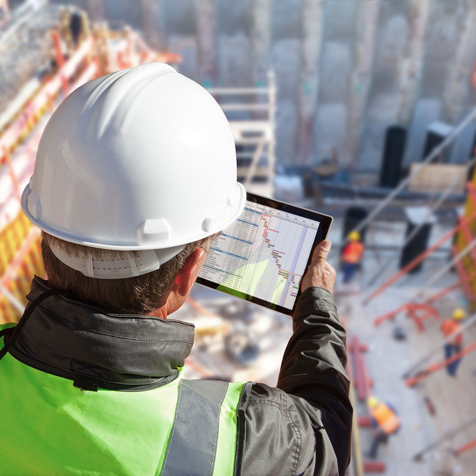 engineer using laptop on site